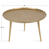 Round gold-toned coffee table with a textured, slightly wavy edge and three tapered cylindrical legs, measuring 26 inches wide and 15.75 inches tall.