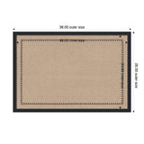 Rectangular woven mat with a black scalloped border pattern around a natural beige center, measuring 38 by 26 inches outer size.