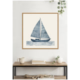 Framed square canvas print of a minimalist navy blue sailboat with linear patterned sails above a line-patterned blue sea, hanging above a modern wooden console table.