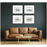 Four black-framed vintage European sketches arranged in a grid on a dark wall above a brown leather sofa with a wooden coffee table holding a glass vase and candles.