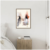 Abstract watercolor painting with blended washes of black, gray, red, and white, accented by gold lines, displayed in a simple brown frame on a white wall.