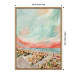 Framed canvas painting of a beach scene with a sandy path, colorful dunes, and a pastel sky blending blue and coral tones, signed by Annie Quigley.