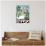 Colorful framed canvas of a tiger sitting in a white clawfoot bathtub surrounded by lush green plants and pink flowers against a light blue patterned wall.