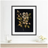 Framed painting of muted-tone flowers with green and tan leaves on a dark background, hanging above a white surface with a candle and small flower arrangement.