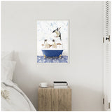 Framed canvas with three penguins in a blue clawfoot bathtub against wallpaper with blue floral branches and blue patterned tile floor, hung on a white bedroom wall above a wooden bedside table.
