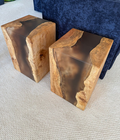 Two wooden side tables with a natural maple finish and epoxy accents on a white background
