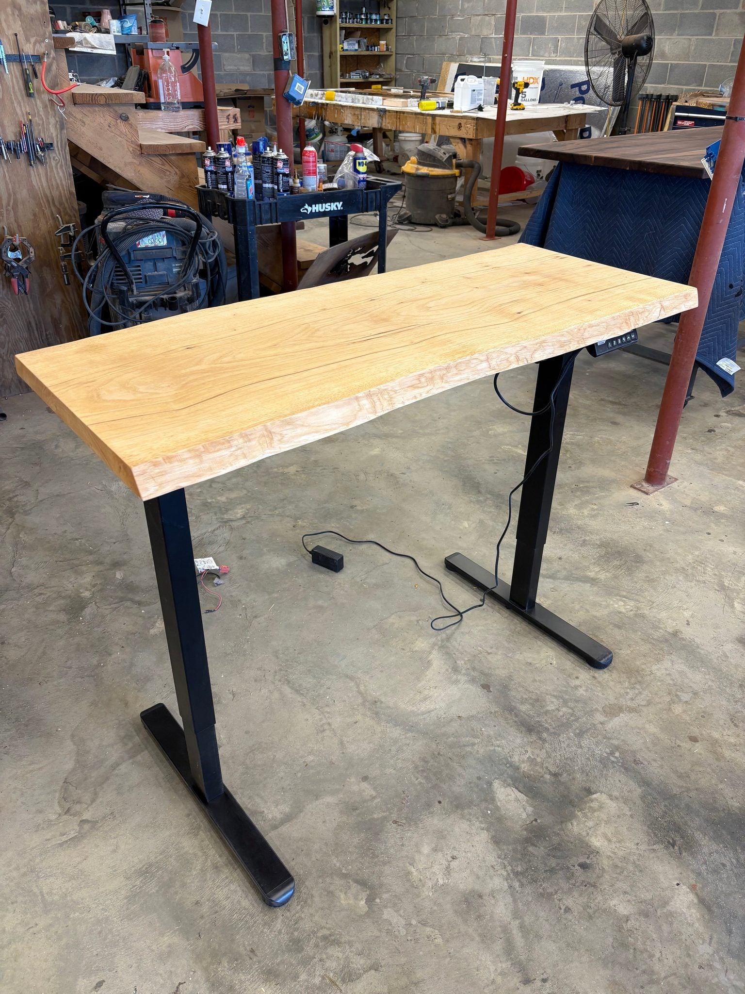 Adjustable height sit/stand pecan desk with wooden finish and metal legs