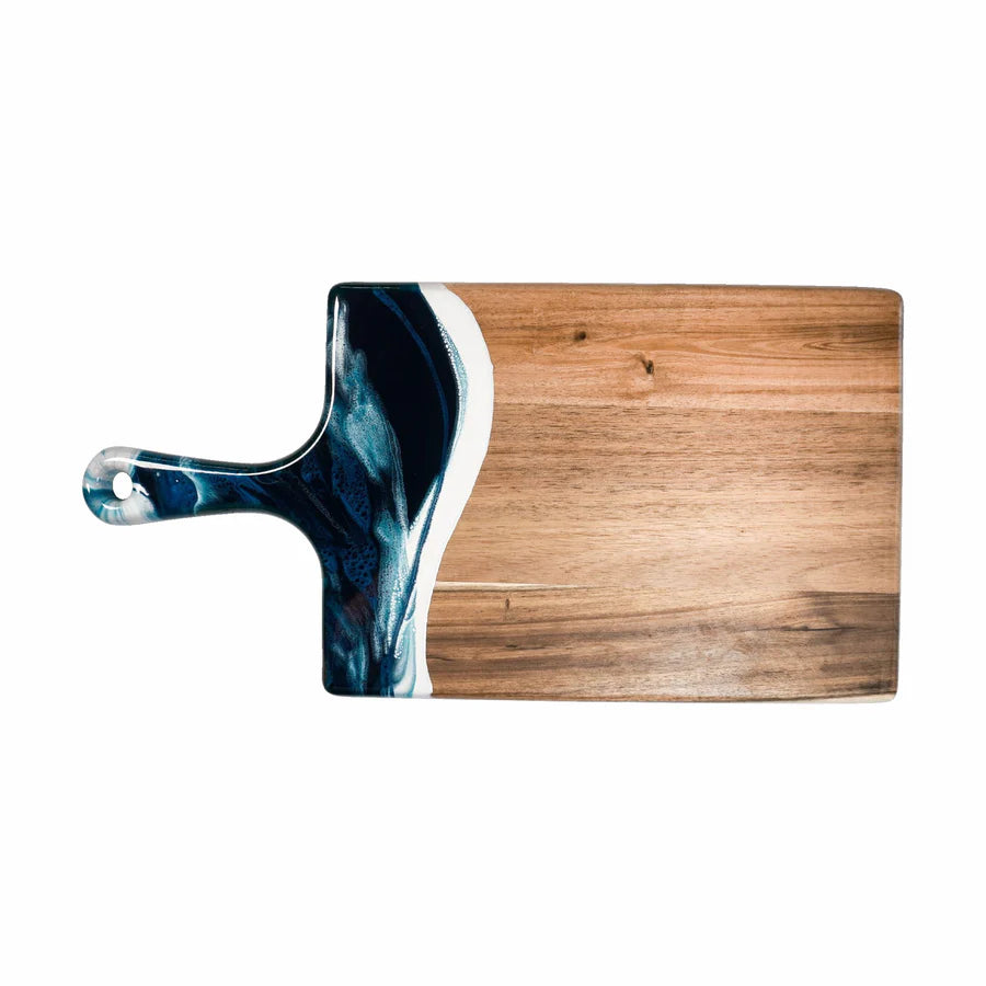 Wooden resin charcuterie board with a blue and white handle on a white background