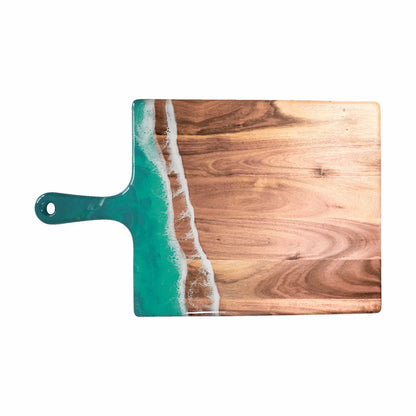 Wooden charcuterie serving tray with a green resin design on a white background