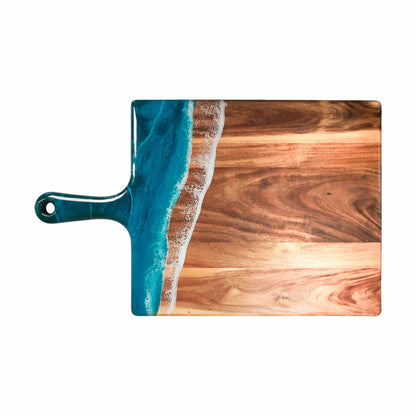 Wooden charcuterie serving tray with blue resin design on a white background