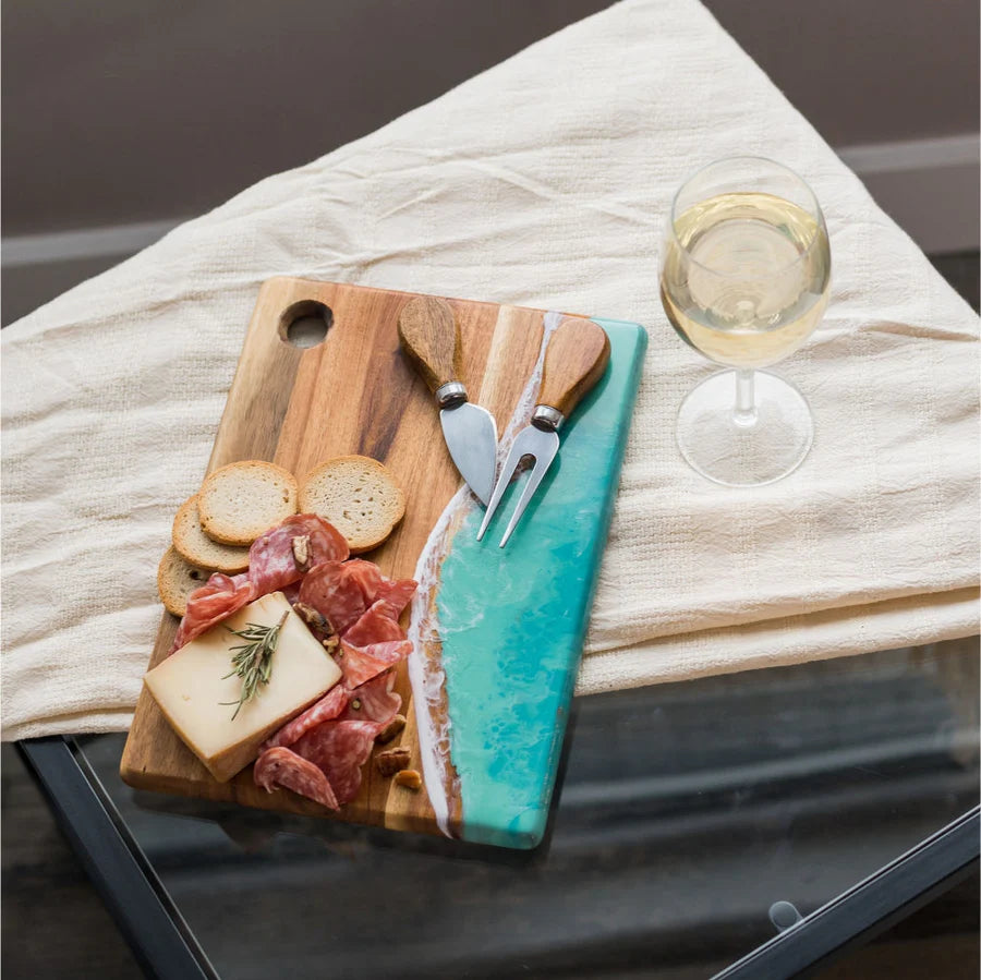 Wooden Cheese Charcuterie Serving Board with charcuterie and a glass of white wine on a marble surface