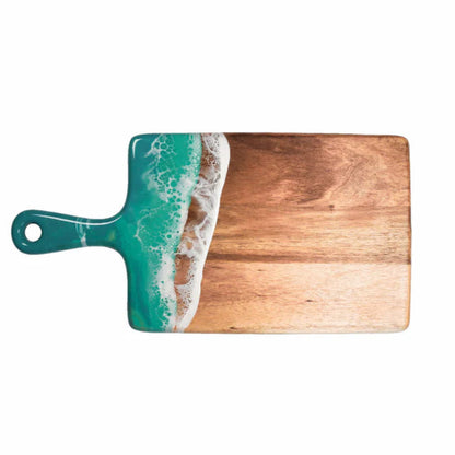 Wooden resin charcuterie board with a handle featuring an ocean wave design on a white background