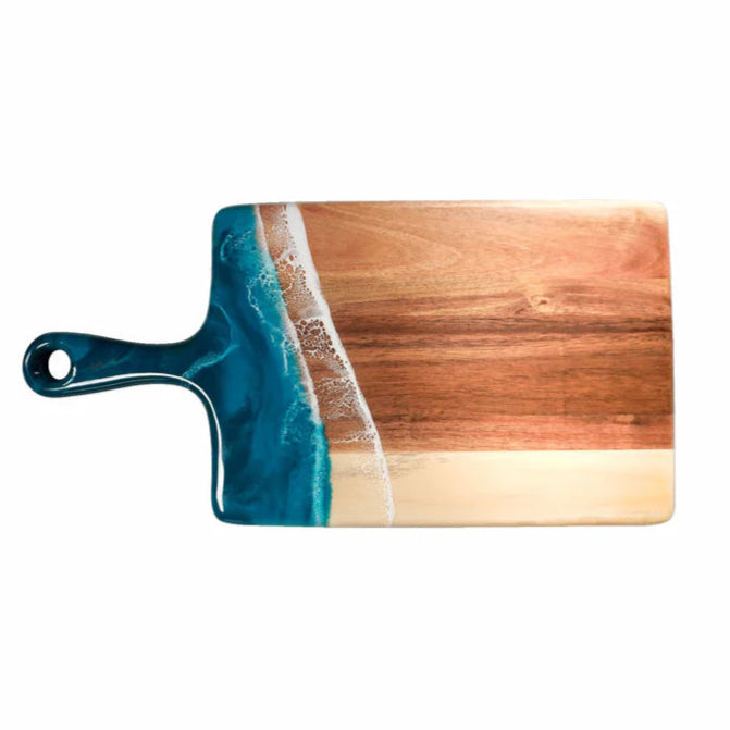 Wooden resin charcuterie board with a blue resin design on a white background