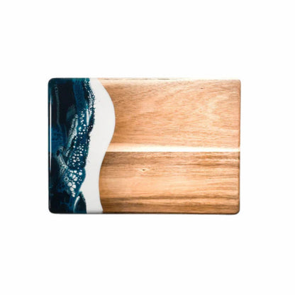 Wooden resin charcuterie board with a blue and white design on a white background