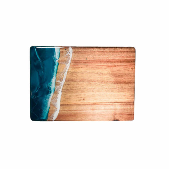 Wooden resin charcuterie board with a blue resin design on a white background