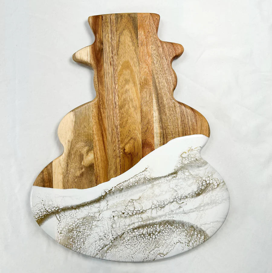 Snowman Resin Charcuterie Board with colorful resin design on acacia wood, displayed on kitchen counter
