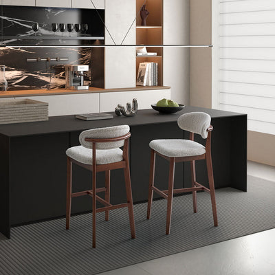 Pair of ACTU Bar Stools with cherry wood tapered legs and beige upholstered seats in mid-century modern style