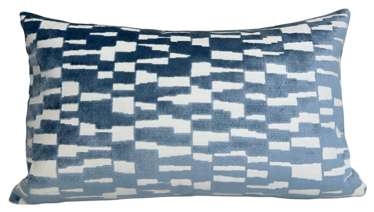 Rectangular pillow cover in marine blue velvet with an abstract geometric pattern of irregular white rectangles and squares.