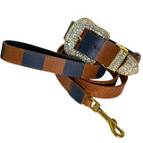 Brown and navy blue checkered collar with large gold buckle encrusted with clear Swarovski crystals, attached to a textured brown leash with gold clip.