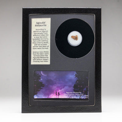 Genuine Agoudal Meteorite showcased in a labeled glass display box