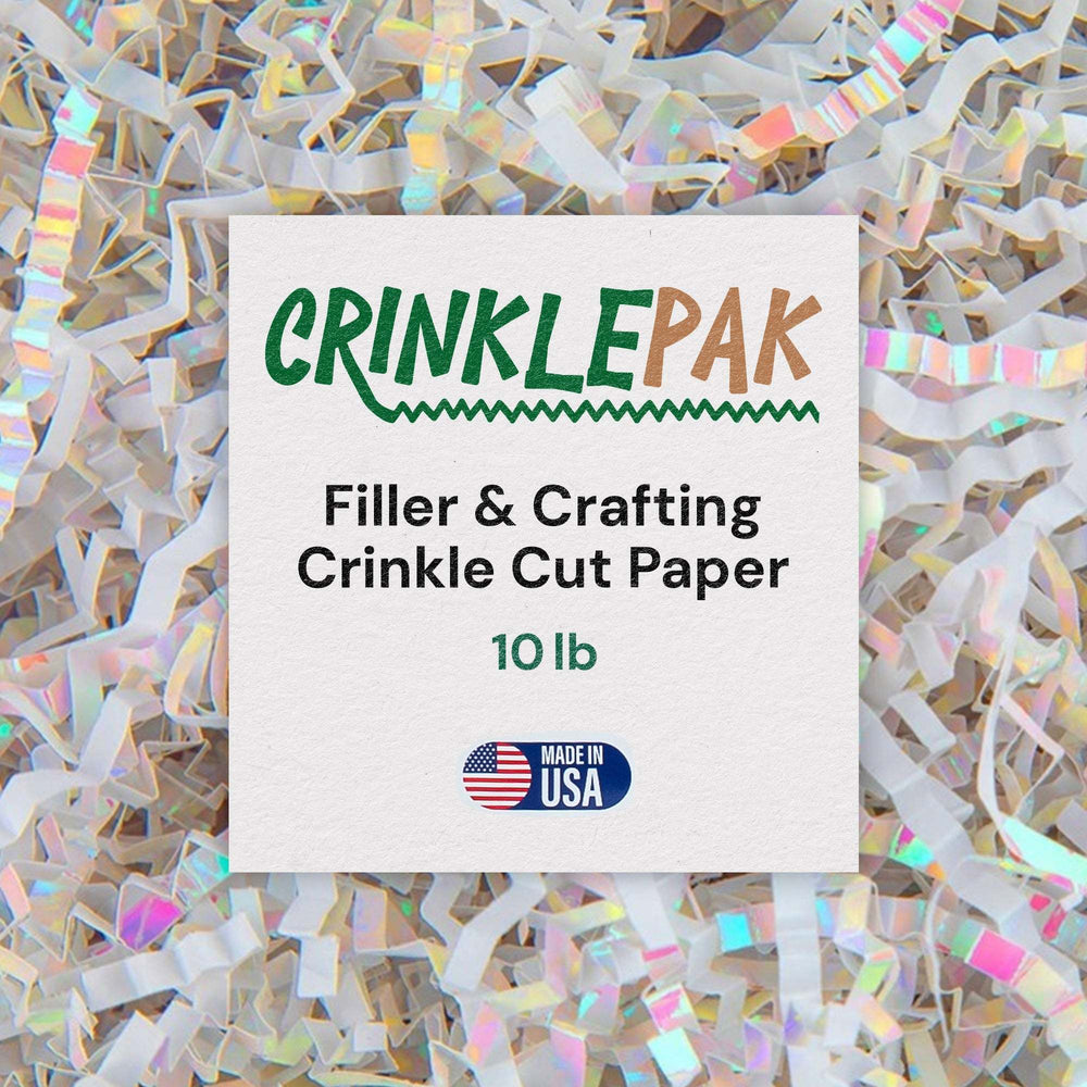 White crinkle cut paper with iridescent rainbow reflections fills the frame behind a label stating 'CrinklePak Filler & Crafting Crinkle Cut Paper 10 lb Made in USA'.