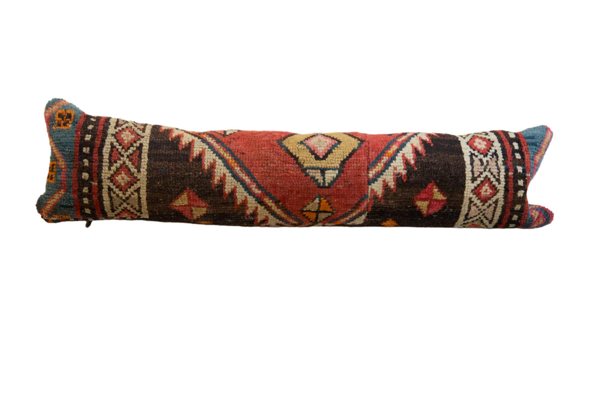 Vintage Rug Fragment Lumbar Pillow showing intricate hand-knotted rug patterns in earth tones
