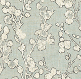 Close-up of Aylin Floral Pillow Cover fabric with off-white floral branches on a muted blue-green eucalyptus background, featuring textured woven textile detail.
