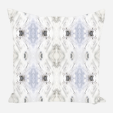 Square pillow with a symmetrical abstract pattern in soft shades of white, gray, and light blue, featuring diamond shapes and blurred edges.