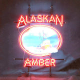 Red neon sign with the words 'ALASKAN AMBER' surrounding a central circular image of a boat against a blue sky background.