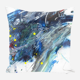 Abstract pillow design with swirling blue, gray, and white brushstrokes accented by bright yellow paint splatters and dark blue spots.