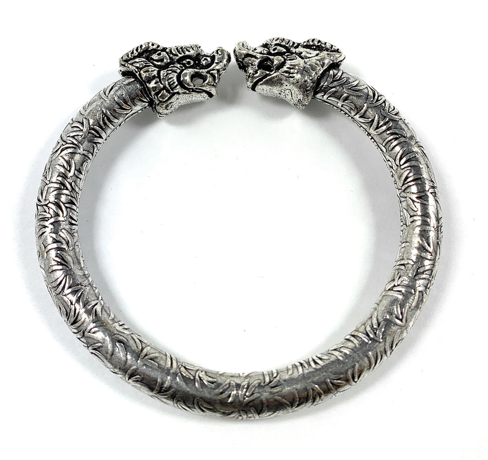 Antique Norse Bracelet with two lion heads and leaf pattern visible