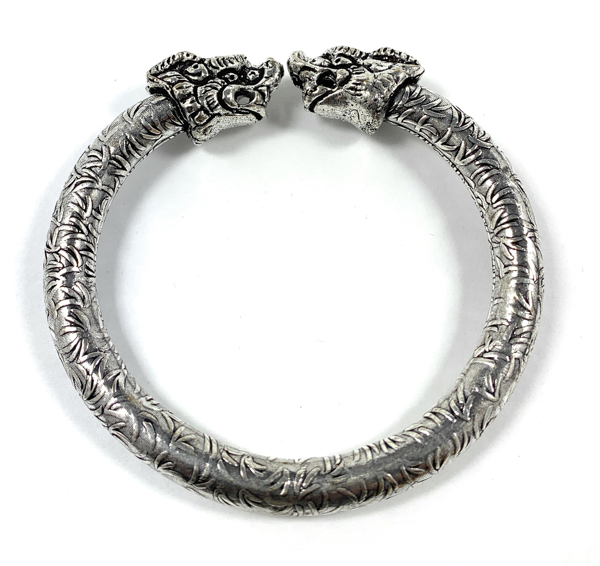 Antique Norse Bracelet with two lion heads and leaf pattern visible