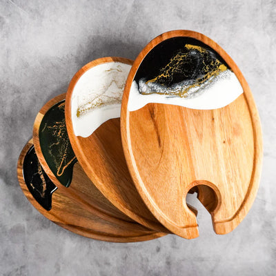 Set of four wine and appetizer trays made of acacia wood with resin details by Lynn & Liana Designs