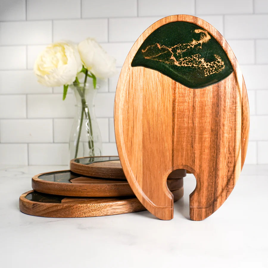 Wooden resin Wine & Appetizer Trays  with green inlay on a white surface with flowers in the background
