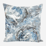 Square pillow with abstract design featuring swirling blue, white, gray, and black brushstrokes creating two circular patterns.