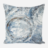 Square pillow featuring abstract circular brushstrokes in shades of blue, white, and gray with textured, layered paint effects.