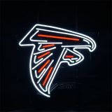 Neon sign of an Atlanta Falcons logo outlined in white with red accents on a black background, depicting a stylized falcon head in profile.