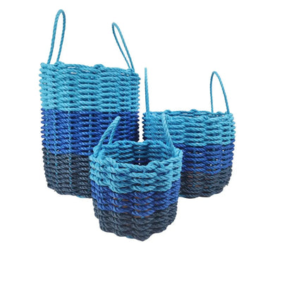 Handwoven storage basket made from navy blue, blue, and light blue Maine lobster rope