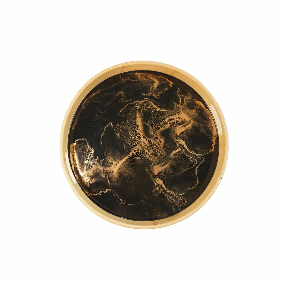 Round decorative serving tray with gold and black marbled pattern on a white background