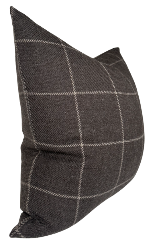 Square dark brown wool pillow cover with a subtle beige windowpane check pattern, shown from an angled side view highlighting its soft texture.