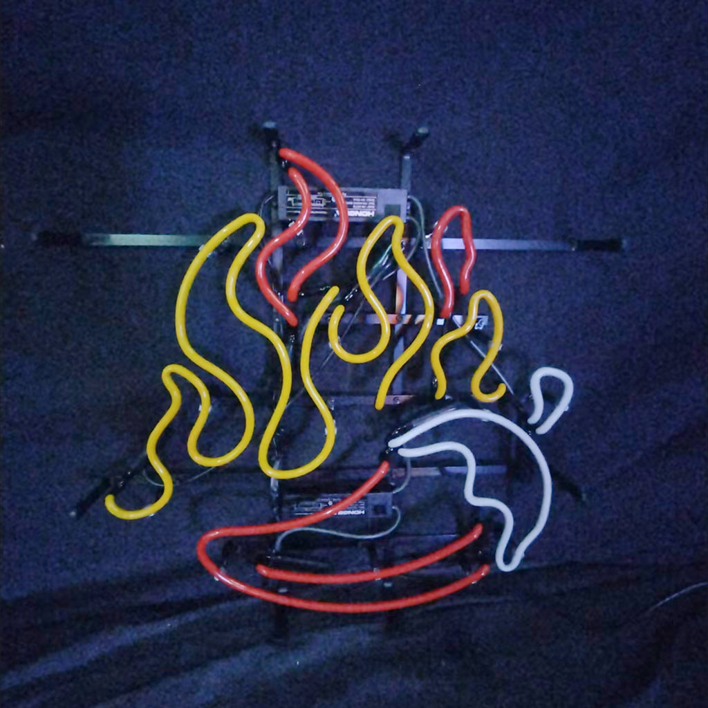 Neon sign displaying stylized red chili pepper and alternating red and yellow flames on a black background with visible mounting frame.