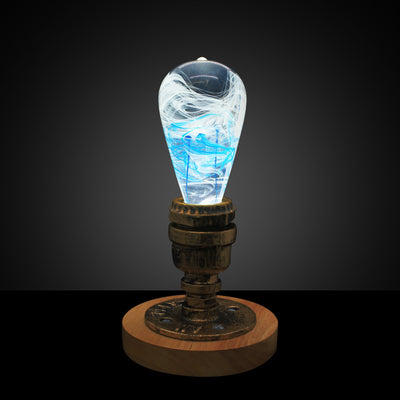 EP Light Blue-Drop Resin LED Bulb handcrafted with eco-friendly resin, shown with wooden base options