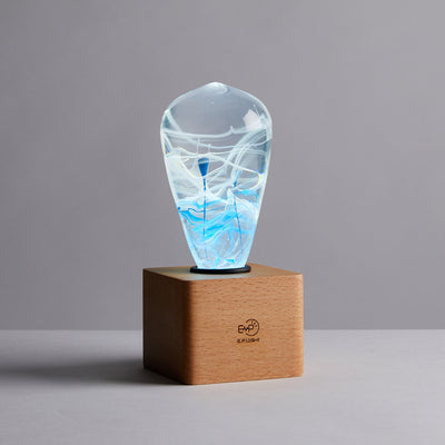 EP Light BlueDrop Resin Table Lamp with wooden base and glowing LED bulb