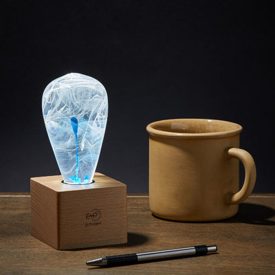 EP Light BlueDrop Resin Table Lamp with wooden base and glowing LED bulb
