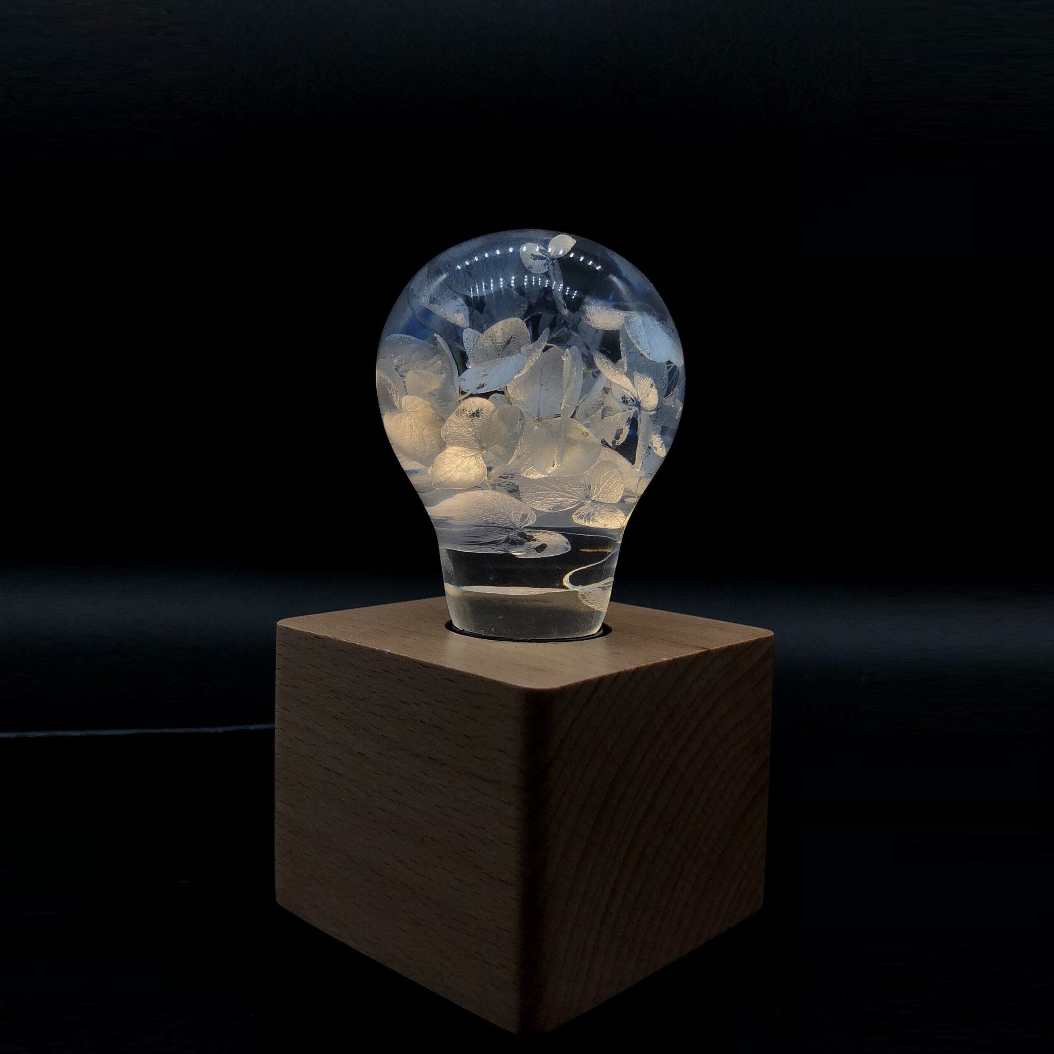 Handcrafted blue hydrangea resin LED bulb with wooden base