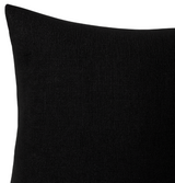 Square black pillow cover with subtle raised dash patterns creating texture on woven fabric, shown in close-up against a white background.