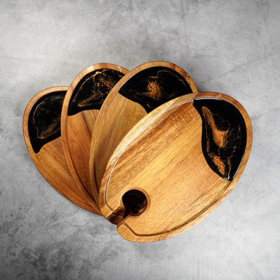 Set of four wine and appetizer trays made of acacia wood with resin details by Lynn & Liana Designs