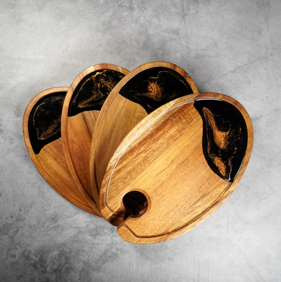 Set of wooden resin Wine & Appetizer Trays  with black accents on a gray surface