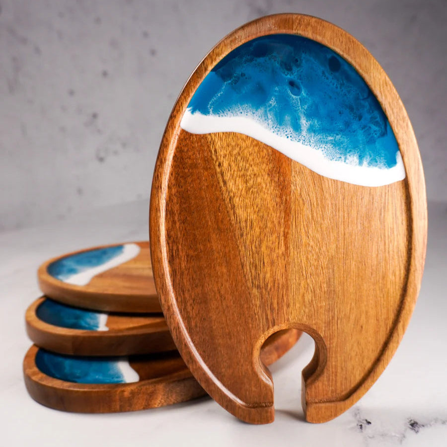 Wooden resin Wine & Appetizer Trays  with blue resin design on a marble surface