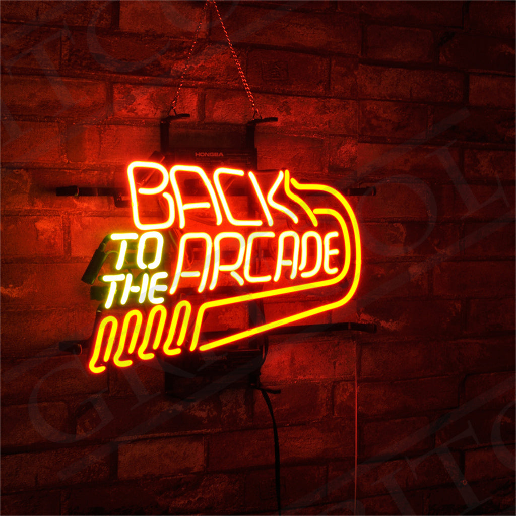 Neon sign on a brick wall reading 'BACK TO THE ARCADE' with orange and yellow glowing letters and an arrow design